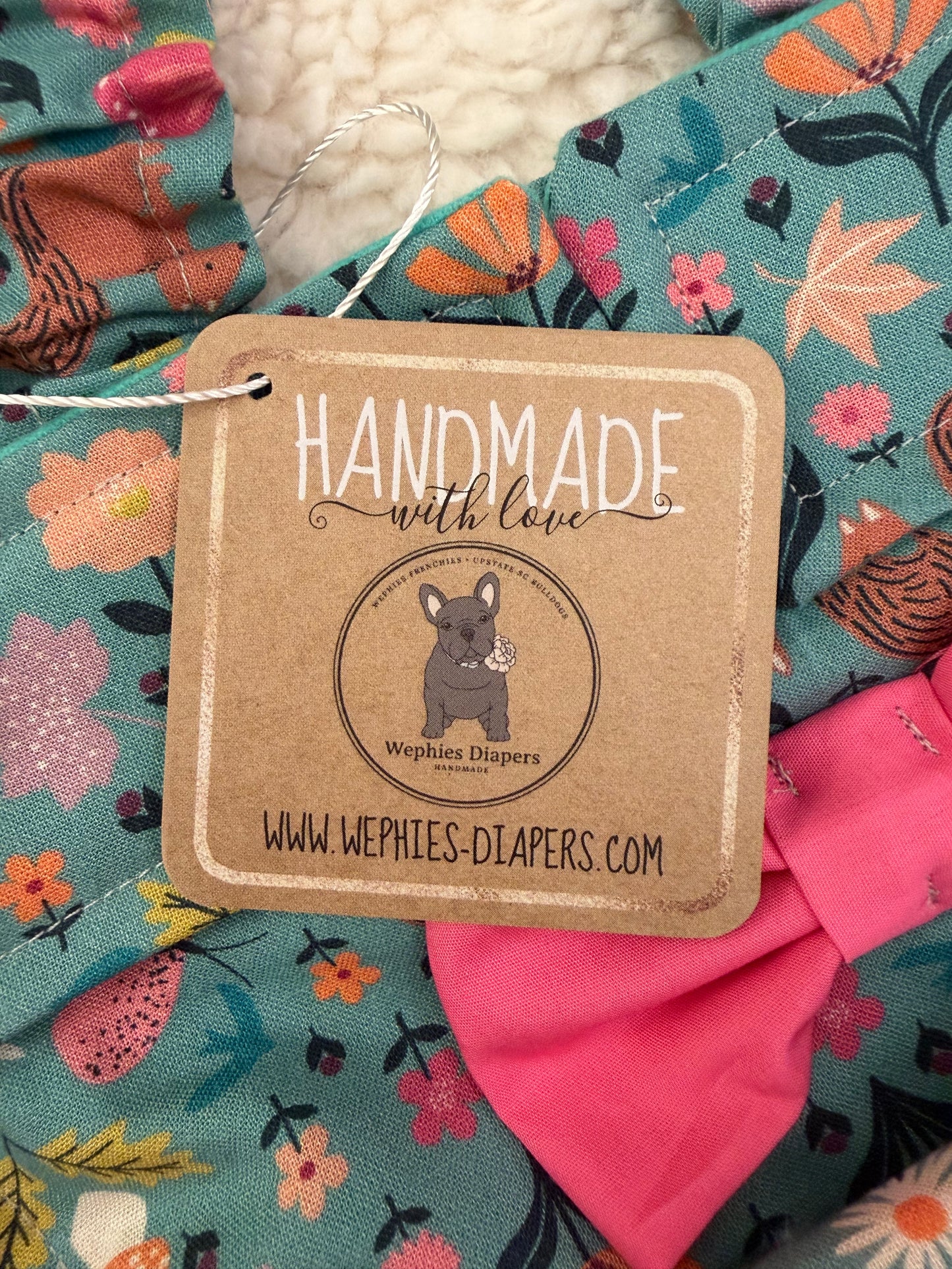 Handmade with love label on a colorful hand sewn item